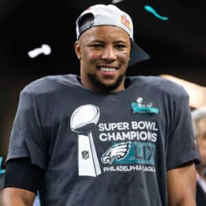 Philadelphia Eagles running back Saquon Barkley (26) celebrates after defeating the Kansas City Chiefs during Super Bowl LIX at Ceasars Superdome.