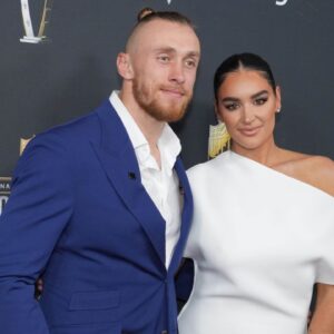 George Kittle and Claire Kittle on the red carpet before Super Bowl LIX NFL Honors at Saenger Theatre.