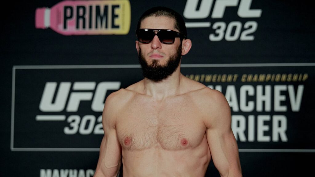 Islam Makhachev poses on the scale during the UFC 302: Weigh-in