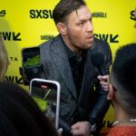 Conor McGregor speaks to press on the red carpet before the premiere of Roadhouse at the Paramount Theatre in Austin