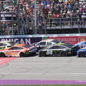 William Byron and Tyler Reddick lead the re-start during overtime of the FireKeepers Casino 400 at Michigan International Speedway.