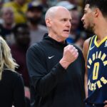 Oct 30, 2024; Indianapolis, Indiana, USA; Indiana Pacers Head Coach Rick Carlisle shares a moment with Indiana Pacers guard Tyrese Haliburton (0) during overtime at Gainbridge Fieldhouse.