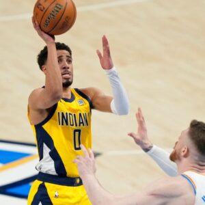 Jun 5, 2025; Oklahoma City, Oklahoma, USA; Indiana Pacers guard Tyrese Haliburton (0) shoots the ball against Oklahoma City Thunder center Isaiah Hartenstein (55) during the third quarter in game one of the 2025 NBA Finals at Paycom Center. Mandatory Credit: Kyle Terada-Imagn Images