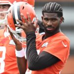 Cleveland Browns quarterback Shedeur Sanders (12) listens to a play call during mini camp at CrossCountry Mortgage Campus.