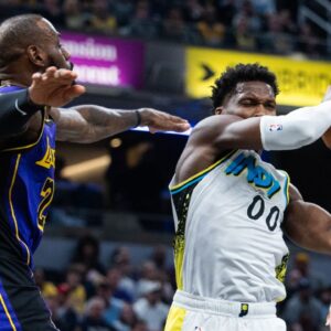 ndiana Pacers guard Bennedict Mathurin (00) shoots the ball while Los Angeles Lakers forward LeBron James (23) defends in the first half at Gainbridge Fieldhouse.