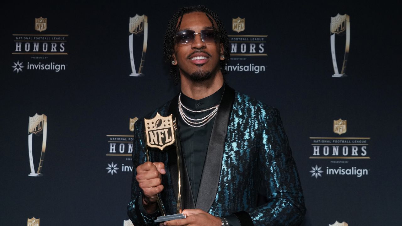 Washington Commanders quarterback Jayden Daniels poses with the Offensive Rookie of the Year award during Super Bowl LIX NFL Honors at Saenger Theatre.