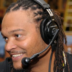 NFL former player Channing Crowder is interviewed on radio row at the Super Bowl XLVI media center at the J.W. Marriott.