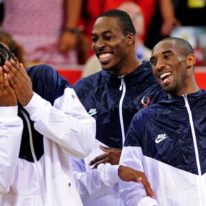 Aug 24, 2008; Beijing, CHINA; USA guard Kobe Bryant (left) jokes around with teammates Carmelo Anthony (left) and Dwight Howard (center) as they wait to be presented with his gold medal for beating Spain in the mens basketball gold medal game at the Beijing Olympic Basketball Gymnasium during the 2008 Beijing Olympic Games. USA beat Spain 118-107 to win the gold medal. Mandatory Credit: Bob Donnan-Imagn Images