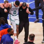 Jayson Tatum is assisted off court with blown Achilles