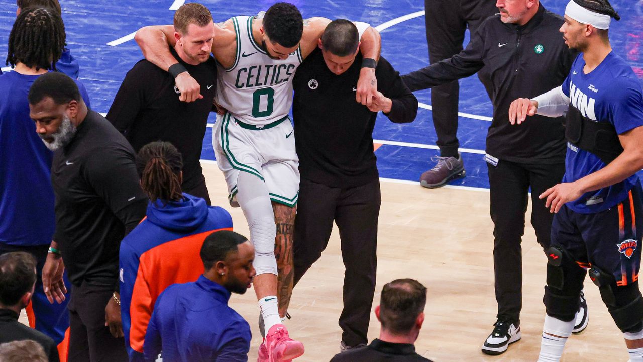 Jayson Tatum is assisted off court with blown Achilles