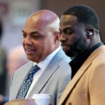 Charles Barkley (left) and Draymond Green (right) look on in the first half between the Dallas Mavericks and the Minnesota Timberwolves during game three of the western conference finals for the 2024 NBA playoffs at American Airlines Center.