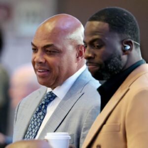 Charles Barkley (left) and Draymond Green (right) look on in the first half between the Dallas Mavericks and the Minnesota Timberwolves during game three of the western conference finals for the 2024 NBA playoffs at American Airlines Center.