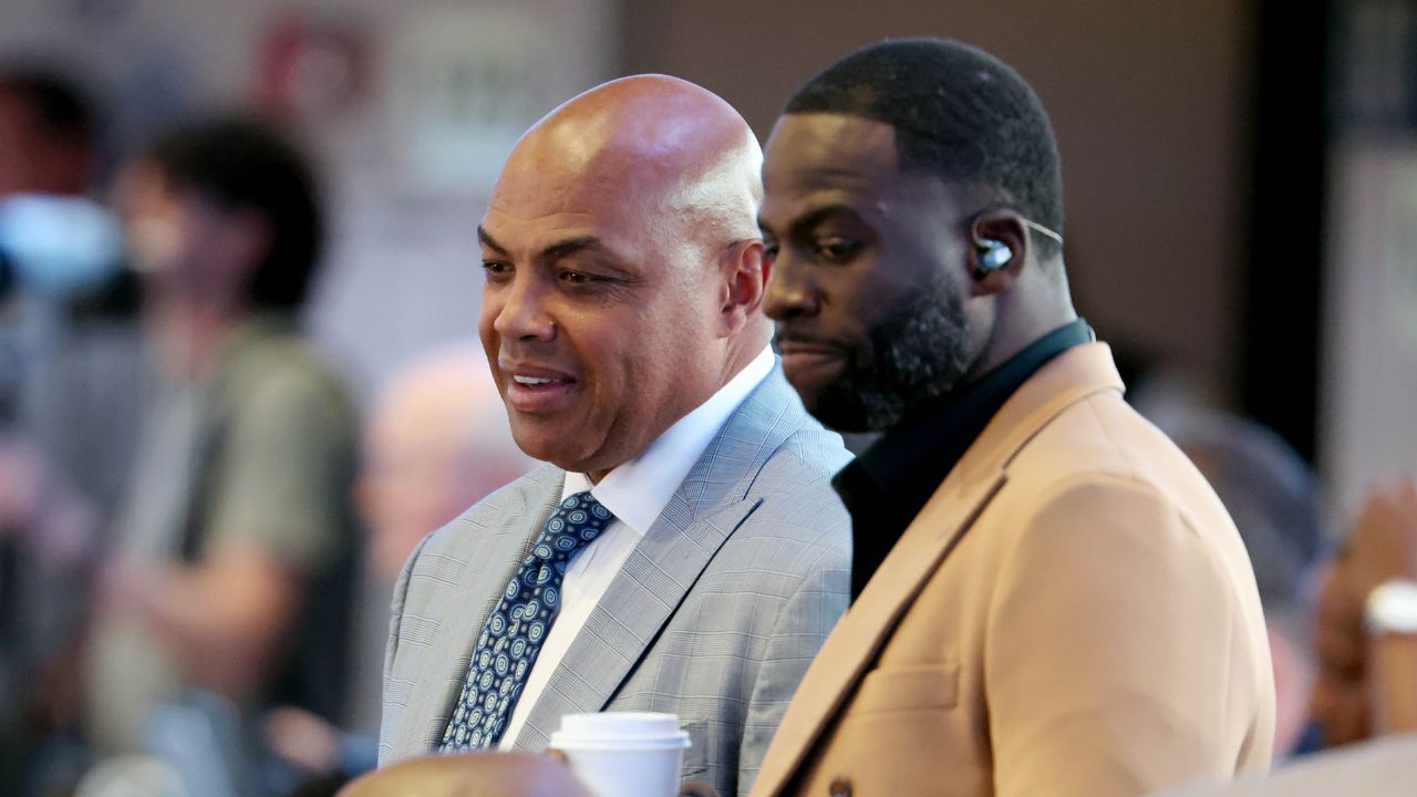Charles Barkley (left) and Draymond Green (right) look on in the first half between the Dallas Mavericks and the Minnesota Timberwolves during game three of the western conference finals for the 2024 NBA playoffs at American Airlines Center.