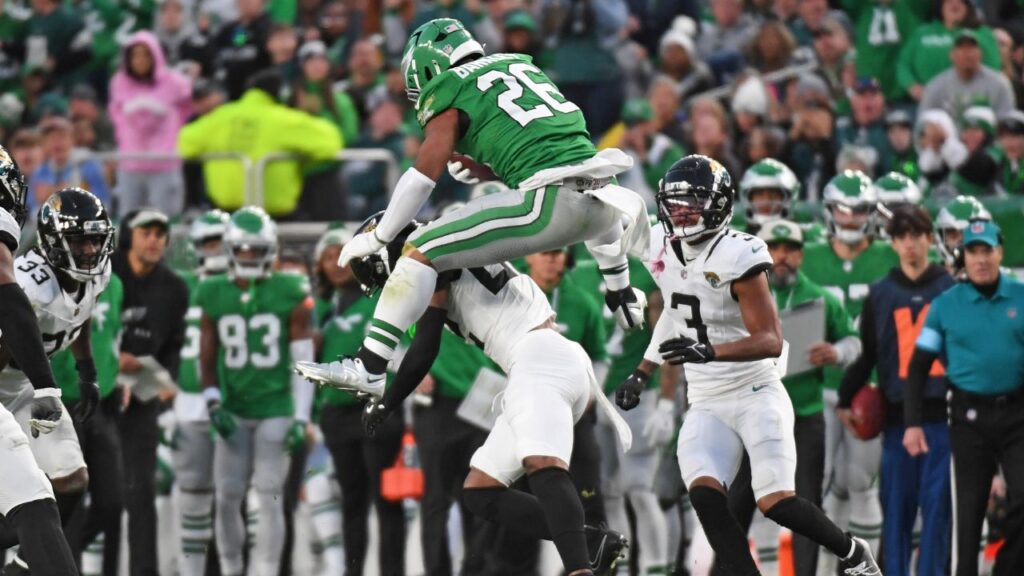Philadelphia Eagles running back Saquon Barkley (26) jumps over Jacksonville Jaguars cornerback Jarrian Jones (22) during the second quarter at Lincoln Financial Field.