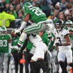 Philadelphia Eagles running back Saquon Barkley (26) jumps over Jacksonville Jaguars cornerback Jarrian Jones (22) during the second quarter at Lincoln Financial Field.