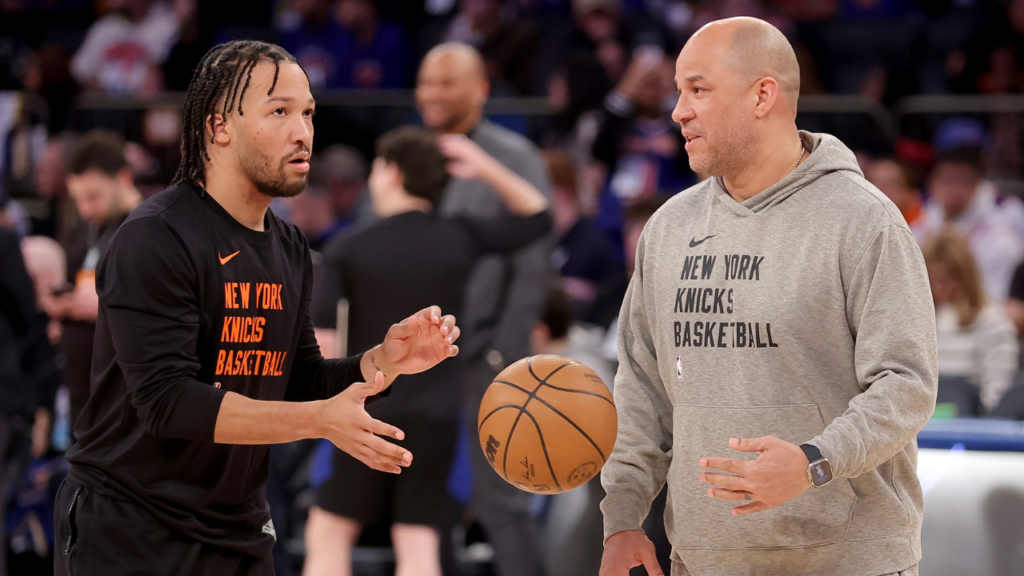 New York Knicks guard Jalen Brunson (11) warms up with assistant coach Rick Brunson (right)