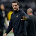 New Orleans Saints quarterback Derek Carr (4) walks the field before a game against the Las Vegas Raiders at Caesars Superdome.