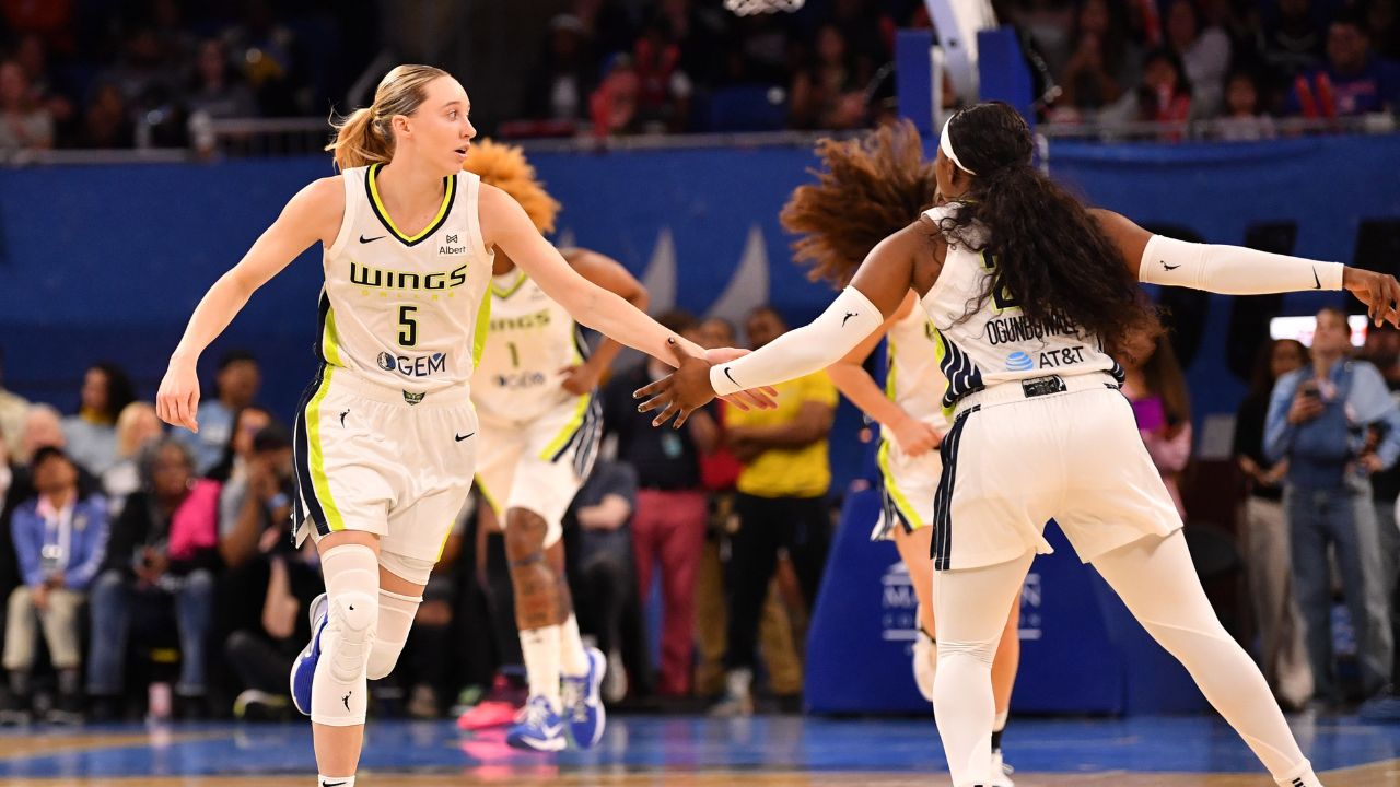 May 29, 2025; Chicago, Illinois, USA; Dallas Wings guard Paige Bueckers (5) celebrates with guard Arike Ogunbowale (24) during the first half against the Chicago Sky at the Wintrust Arena. Mandatory Credit: Patrick Gorski-Imagn Images