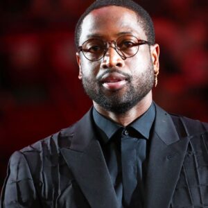Feb 22, 2020; Miami, Florida, USA; Miami Heat former player Dwyane Wade reacts during the second quarter at American Airlines Arena