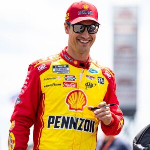 Joey Logano gives out autographs at The Great American Getaway 400 at Pocono Raceway on June 21, 2025.