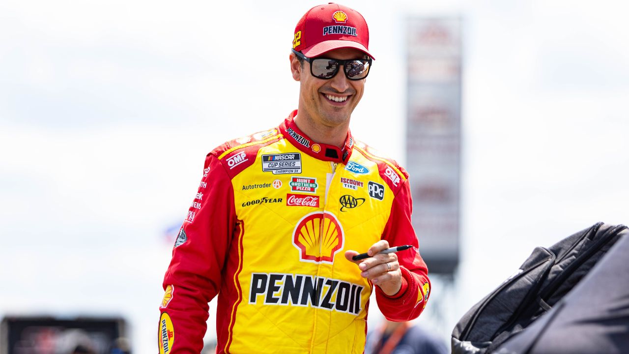 Joey Logano gives out autographs at The Great American Getaway 400 at Pocono Raceway on June 21, 2025.