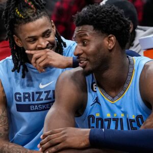 Mar 26, 2023; Atlanta, Georgia, USA; Memphis Grizzlies guard Ja Morant (12) and forward Jaren Jackson Jr. (13) react ons the bench during the game against the Atlanta Hawks during the second half at State Farm Arena
