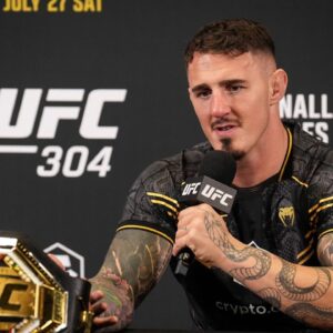 Tom Aspinall with post event media during the UFC 304 event