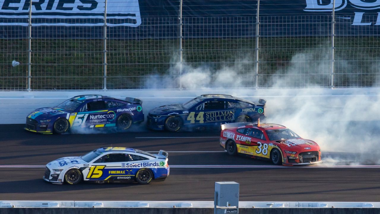NASCAR Cup Series drivers Cody Ware (51) and Todd Gilliland (38) crash alongside David Ragan (15) and Greg Biffle (44) during the Folds of Honor QuikTrip 500 at Atlanta Motor Speedway.