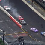 NASCAR Cup Series driver Chase Briscoe (14) shows smoke as he races along Grant Park during the Grant Park 220 of the Chicago Street Race viewed from the NEMA Chicago buliding.