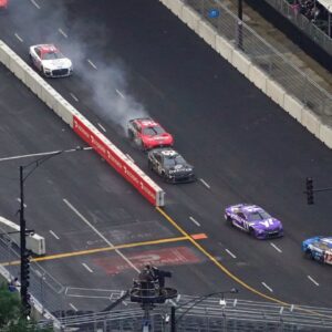 NASCAR Cup Series driver Chase Briscoe (14) shows smoke as he races along Grant Park during the Grant Park 220 of the Chicago Street Race viewed from the NEMA Chicago buliding.