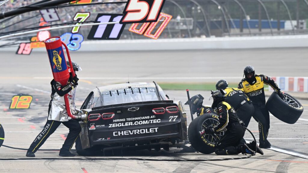NASCAR Cup Series driver Carson Hocevar (77) has to pit with a flat tire after leading much of the final stage of the FireKeepers Casino 400 at Michigan International Speedway. The late pit stop dropped Hocevar to a 29th place finish.