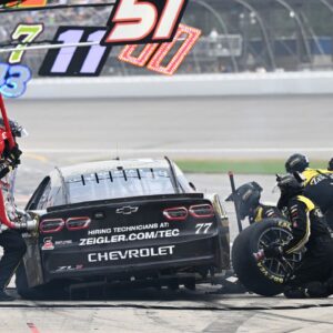 NASCAR Cup Series driver Carson Hocevar (77) has to pit with a flat tire after leading much of the final stage of the FireKeepers Casino 400 at Michigan International Speedway. The late pit stop dropped Hocevar to a 29th place finish.