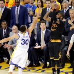 Cleveland Cavaliers guard Kyrie Irving (2) shoots the the game winning shot during the fourth quarter against Golden State Warriors guard Stephen Curry (30) in game seven of the NBA Finals at Oracle Arena.