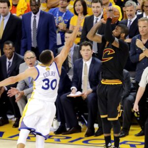 Cleveland Cavaliers guard Kyrie Irving (2) shoots the the game winning shot during the fourth quarter against Golden State Warriors guard Stephen Curry (30) in game seven of the NBA Finals at Oracle Arena.