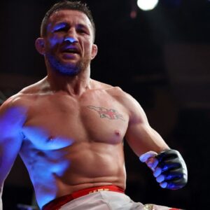Merab Dvalishvili (red gloves) reacts after defeating Sean O’Malley (not pictured) in a bantamweight title fight during UFC 316 at Prudential Center.