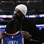 UFC mixed martial arts heavyweight champion Jon Jones poses for a photo before a game between the New York Knicks and the Chicago Bulls at Madison Square Garden.