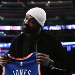 UFC mixed martial arts heavyweight champion Jon Jones poses for a photo before a game between the New York Knicks and the Chicago Bulls at Madison Square Garden.