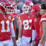 Dec 10, 2017; Kansas City, MO, USA; Kansas City Chiefs quarterback Alex Smith (11) talks with quarterback Patrick Mahomes (15) during the first half against the Oakland Raiders at Arrowhead Stadium.