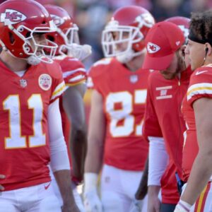 Dec 10, 2017; Kansas City, MO, USA; Kansas City Chiefs quarterback Alex Smith (11) talks with quarterback Patrick Mahomes (15) during the first half against the Oakland Raiders at Arrowhead Stadium.