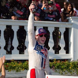 NASCAR Cup Series driver Ryan Blaney celebrates in victory lane after winning the Pocono 400 at Pocono Raceway.