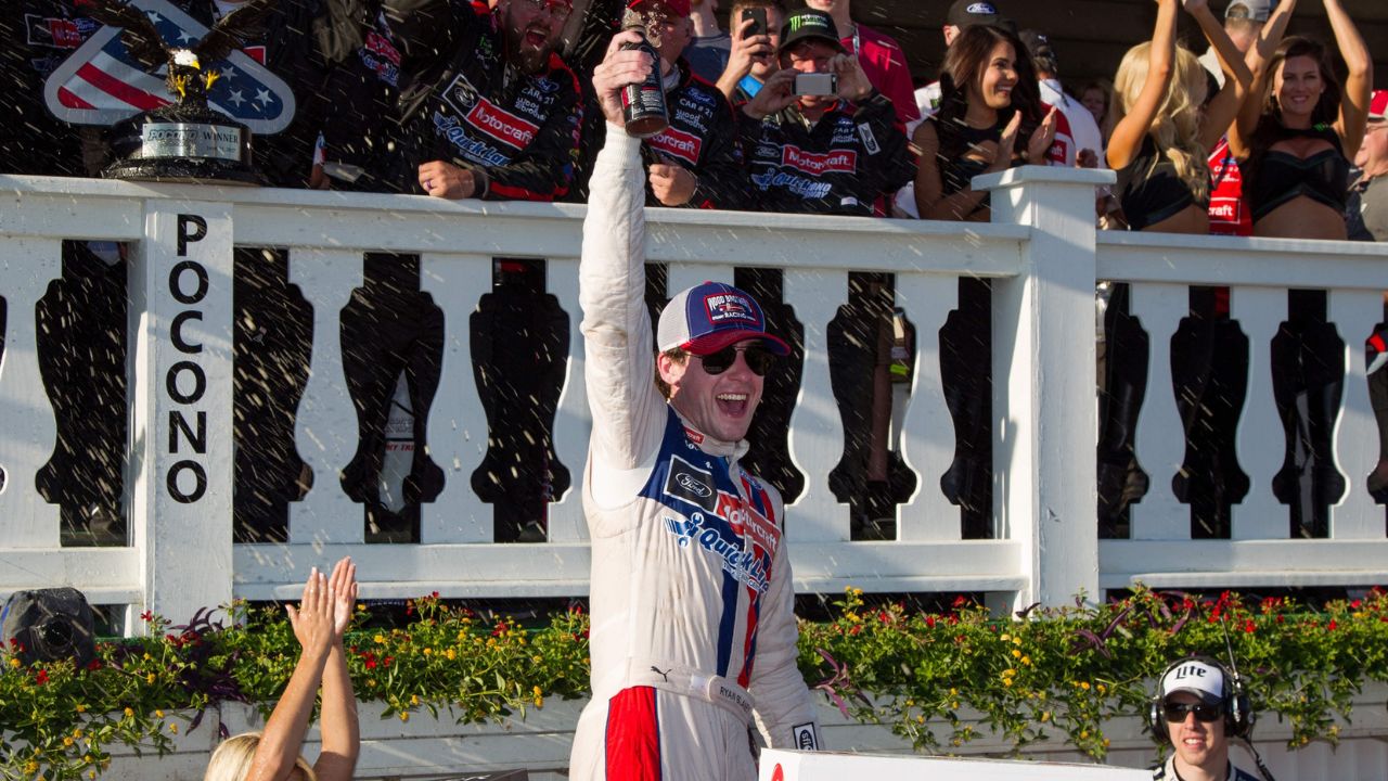 NASCAR Cup Series driver Ryan Blaney celebrates in victory lane after winning the Pocono 400 at Pocono Raceway.