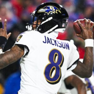 Jan 19, 2025; Orchard Park, New York, USA; Baltimore Ravens quarterback Lamar Jackson (8) throws the ball during the fourth quarter against the Buffalo Bills in a 2025 AFC divisional round game at Highmark Stadium. Mandatory Credit: Mark Konezny-Imagn Images