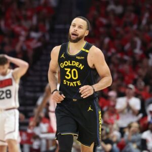 Golden State Warriors guard Stephen Curry (30) reacts after scoring a basket during the second half of game seven of the first round for the 2025 NBA Playoffs against the Houston Rockets at Toyota Center.