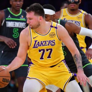 Los Angeles Lakers guard Luka Doncic (77) controls the ball against the Minnesota Timberwolves during the second half in game five of first round for the 2025 NBA Playoffs at Crypto.com Arena.