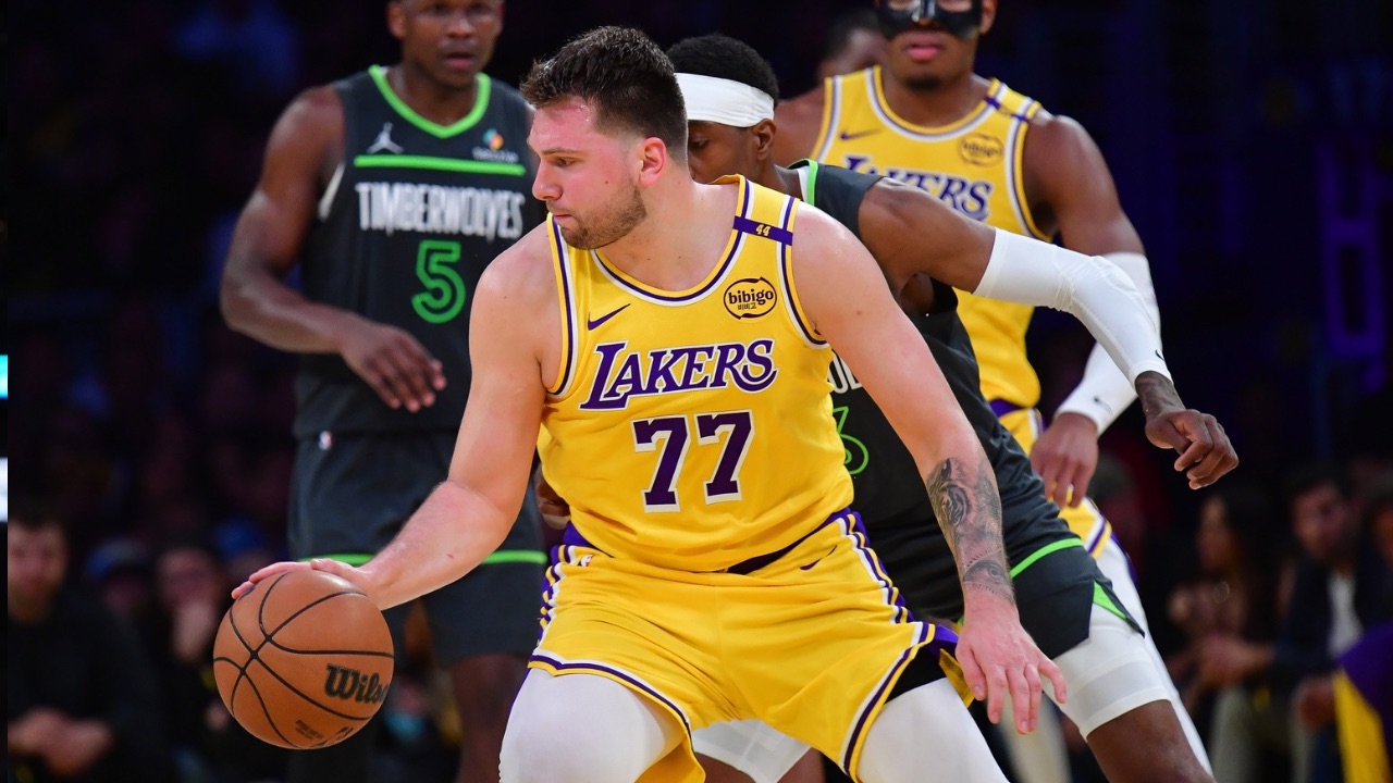 Los Angeles Lakers guard Luka Doncic (77) controls the ball against the Minnesota Timberwolves during the second half in game five of first round for the 2025 NBA Playoffs at Crypto.com Arena.