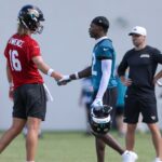 Jacksonville Jaguars quarterback Trevor Lawrence (16) and wide receiver Travis Hunter (12) participate in training camp at Miller Electric Center.