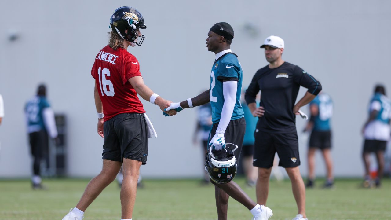 Jacksonville Jaguars quarterback Trevor Lawrence (16) and wide receiver Travis Hunter (12) participate in training camp at Miller Electric Center.