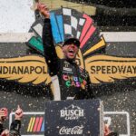 NASCAR Cup Series driver Bubba Wallace (23) celebrates winning Sunday, July 27, 2025, the Brickyard 400 at Indianapolis Motor Speedway.