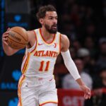 Atlanta Hawks guard Trae Young (11) dribbles up court during the first quarter against the Brooklyn Nets at Barclays Center.