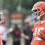 Cleveland Browns quarterback Joe Flacco (15) talks to quarterback Shedeur Sanders (12) during mini camp at CrossCountry Mortgage Campus.